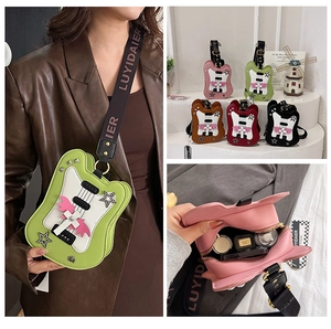 Detail view of guitar shaped crossbody bag showing colors and internal storage capacity