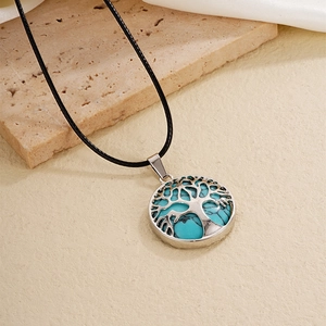 Minimalist Tree of Life necklace with natural turquoise stone pendant on black cord