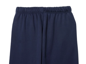 Detail of the elastic waistband on deep blue knitted casual trousers for women