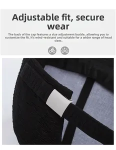 Detail of adjustable metal buckle and pleated black fabric texture on baseball cap