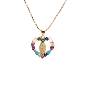 Golden heart necklace with Virgin Mary relief and colorful zircon crystals on white background