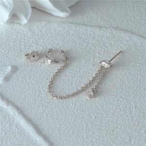 Macro detail of S925 sterling silver chain earrings with marquise cut zircon and opal