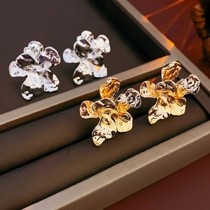 French vintage metallic flower stud earrings with textured petals in gold and silver