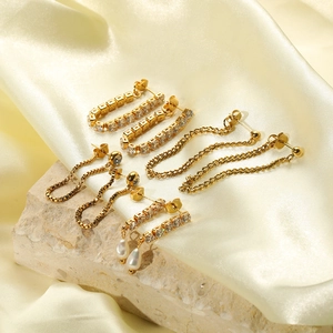 18K gold plated titanium steel earring set with rhinestones, chains and pearls on silk