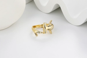 Detailed view of the golden hammerhead shark open ring with polished metal finish