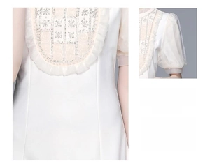 Détail de la robe en soie blanche avec dentelle pailletée et manches bouffantes en mesh