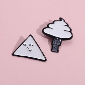Cartoon white ghost and cloud tree enamel pins on a soft pink background