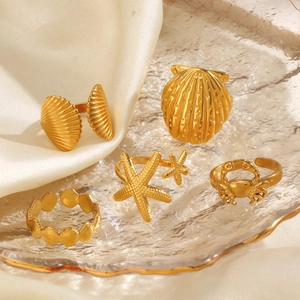 5-piece gold stainless steel marine ring set featuring starfish shell and crab designs