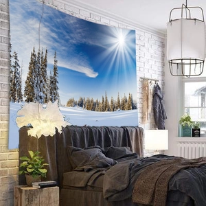Detailed view of snowy winter forest tapestry hung as a wall decor in a bedroom