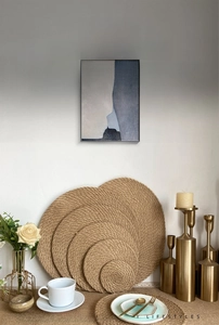 Macro view of woven jute placemats showing natural spiral texture and thick heat resistance