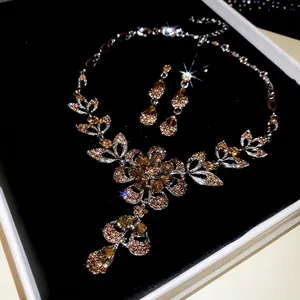 Elegant floral jewelry set with champagne crystal necklace and matching teardrop earrings