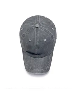 Top view of washed grey baseball cap featuring embroidered Campus text and ventilation holes