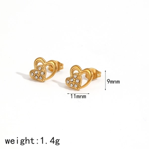 Detail view of 18k gold plated heart stud earrings with sparkling cubic zirconia stones