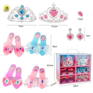 Macro view of princess dress-up set with toy high heels, crowns, and jewelry in storage box