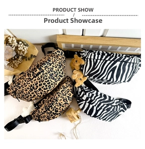 Detail of canvas chest bags with leopard and zebra patterns featuring adjustable nylon straps