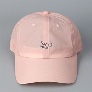 Detailed embroidery of an elephant on a light pink quick-dry baseball cap surface