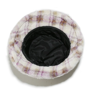 Detail of plaid faux fur bucket hat showing the inner lining and adjustable drawstring