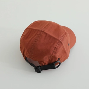 Retro brick red 5-panel camper hat with adjustable strap and breathable metal eyelets