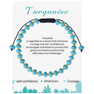 Detail of turquoise beaded bracelet with golden spacers on a symbolic meaning card