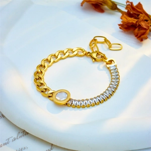Gold chain bracelet featuring zircon inlay and a white mother-of-pearl round pendant