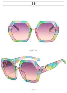 Detail view of hex sun glasses with rainbow glitter frames and golden V-shaped temple accents