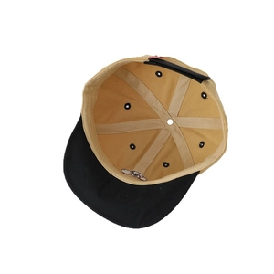 Inside view of a cotton puppy baseball cap with khaki crown and black brim