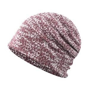 Close-up of the burgundy and white marl knit texture on a slouchy beanie hat