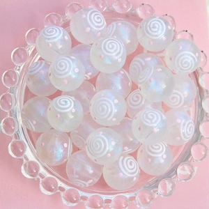Détail de perles en verre lumineux 16mm ciel étoilé avec pois roses pour bijoux artisanaux