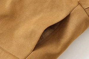 Detail of camel faux suede jacket showing textured fabric and neat side pocket stitching