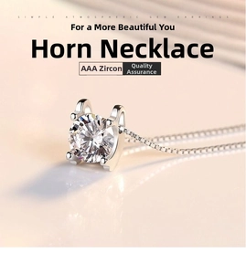 Macro detail of 925 silver bull horn pendant with a sparkling AAA grade zircon stone