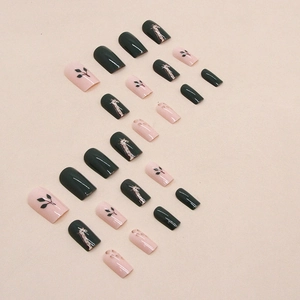 Medium square false nails with dark green and nude pink giraffe and leaf patterns