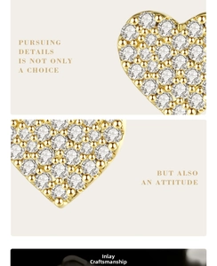 Macro detail of gold-plated heart earring with pave cubic zirconia and beaded edge