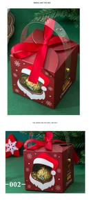 Detail of red Christmas gift box with hollow snowflake window and silk ribbon handle