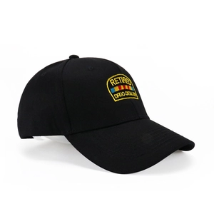 Detail of black baseball cap featuring Retired Drug Dealer embroidery and curved brim