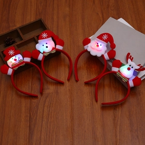 Vier leuchtende Weihnachts-Haarreifen mit Weihnachtsmann-, Schneemann-, Bär- und Rentier-Motiv