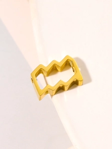 Macro view of a gold-plated geometric wavy spacer bead for DIY jewelry making