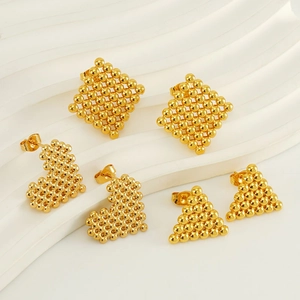 Three pairs of golden geometric stud earrings in diamond, heart, and triangle shapes