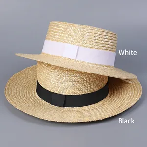 Flat top straw boater hats with elegant black and white ribbons for summer beach sun protection