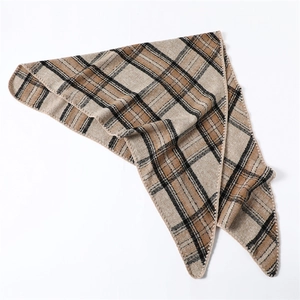 Detail of khaki plaid triangle scarf showing knit texture and finished edge stitching