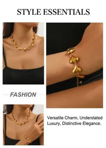 Detail of gold heart link necklace and bracelet set showing premium metallic texture
