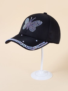 Detail of a black baseball cap featuring shimmering rhinestone butterfly decorations