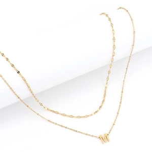 Layered gold necklace featuring a chic paperclip chain and an initial M letter pendant