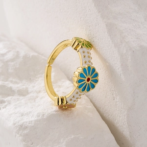 Bohemian gold plated adjustable ring with colorful floral enamel on a white stone base
