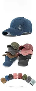 Detail showing vintage washed denim texture and distressed holes on adjustable baseball caps