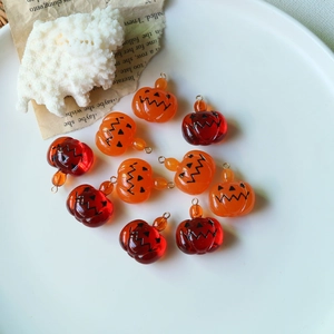 Cute Halloween pumpkin resin charms in orange and dark red for DIY jewelry making