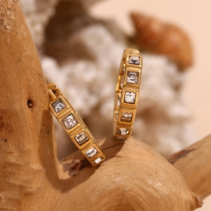 Detail of 18K gold-plated stainless steel hoop earrings with micro-set square zircons