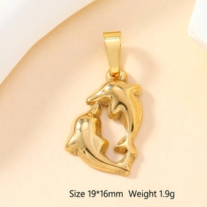 Detailed view of dolphin-shaped gold metal pendant measuring 19x16mm and weighing 1.9g