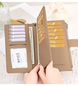 Detailed view of brown RFID leather wallet showing multiple card slots and interior storage