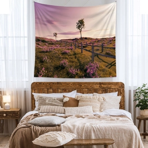 Bohemian landscape tapestry with purple wildflower meadow and wooden fence for wall decor