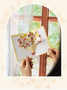Detailed view of a 3D pop-up greeting card featuring a colorful tulip flower bouquet